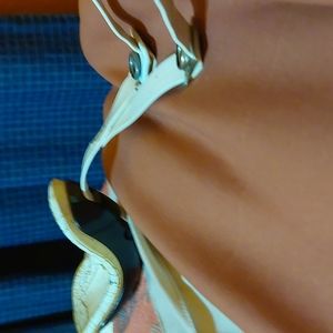 A white and black low hook football chinstrap